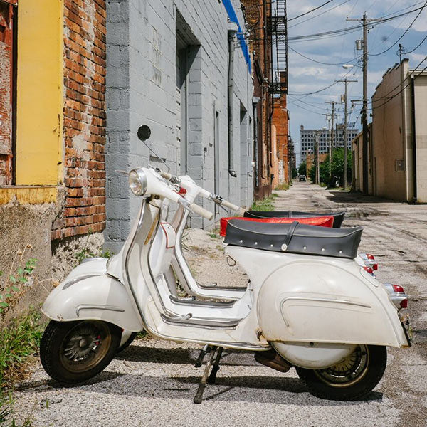 THE LANGUAGE OF LOVE: ITALIAN VESPAS RESTORED IN AN IOWA ALLEY